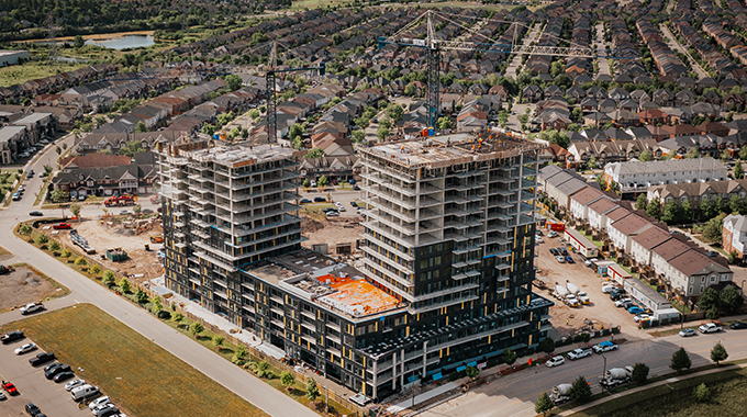 July Construction Update: Realm Condominiums Continue to Rise